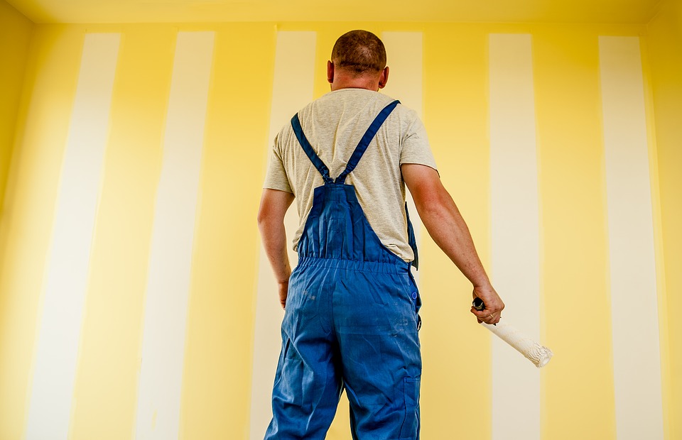 Man painting the wall